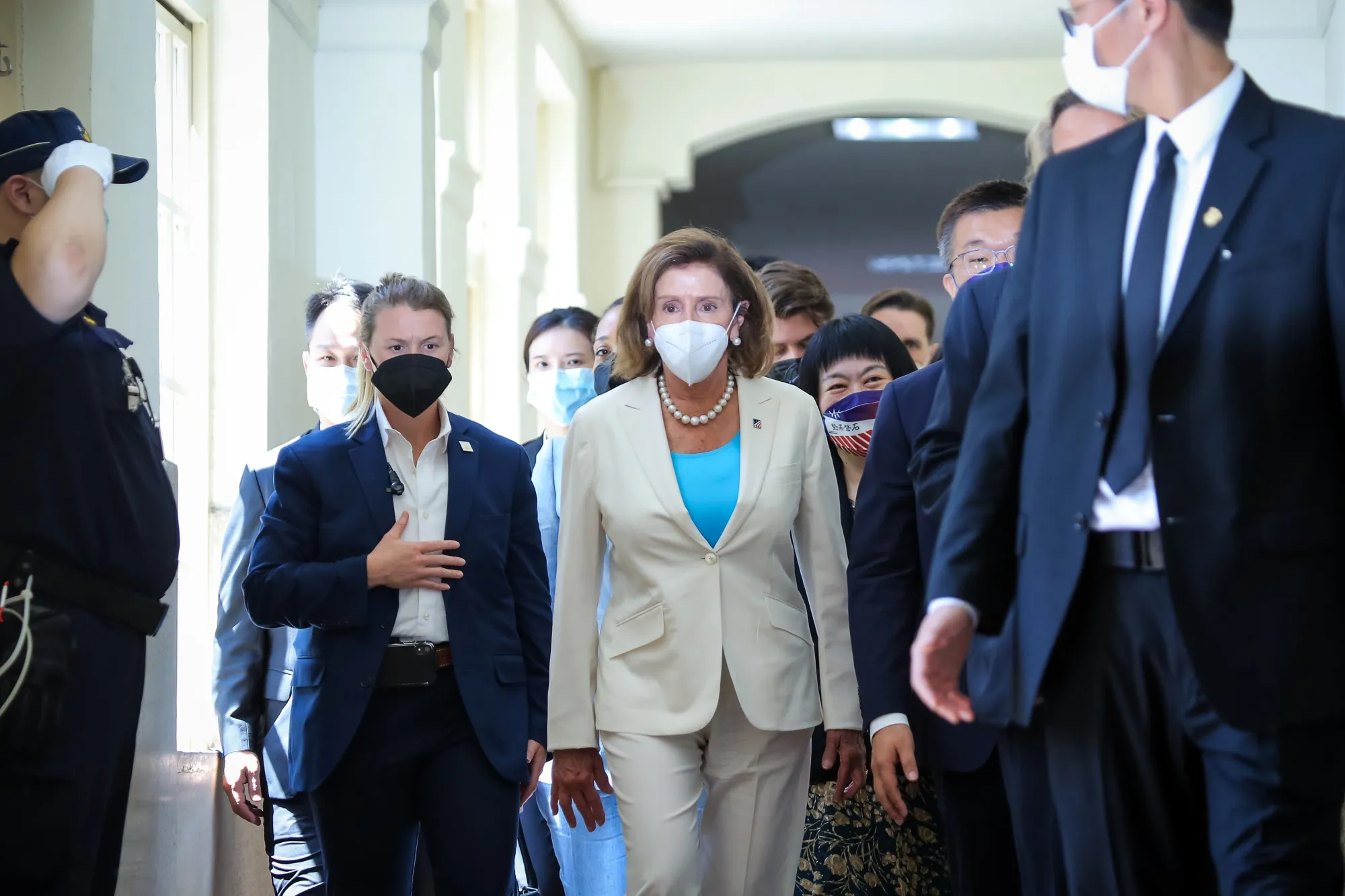 Nancy Pelosi, center, leaves the Legislative Yuan, Taiwan's house of parliament, in Taipei, on Aug. 3.&nbsp;