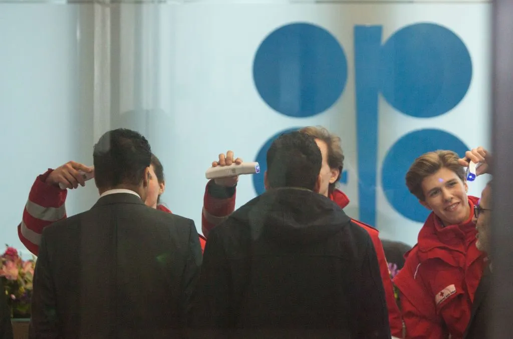 Red Cross medics check the temperature of participants of the 178th meeting of the Organization of Petroleum Exporting Countries (OPEC) in Vienna, Austria, on March 6, 2020.