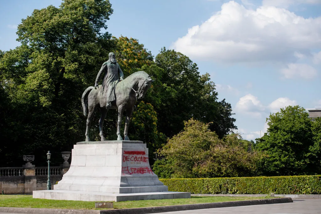 A statue of Leopold II near&nbsp;Trone metro station on July 11, 2020 in Brussels, with anti-colonial graffiti on its base.
