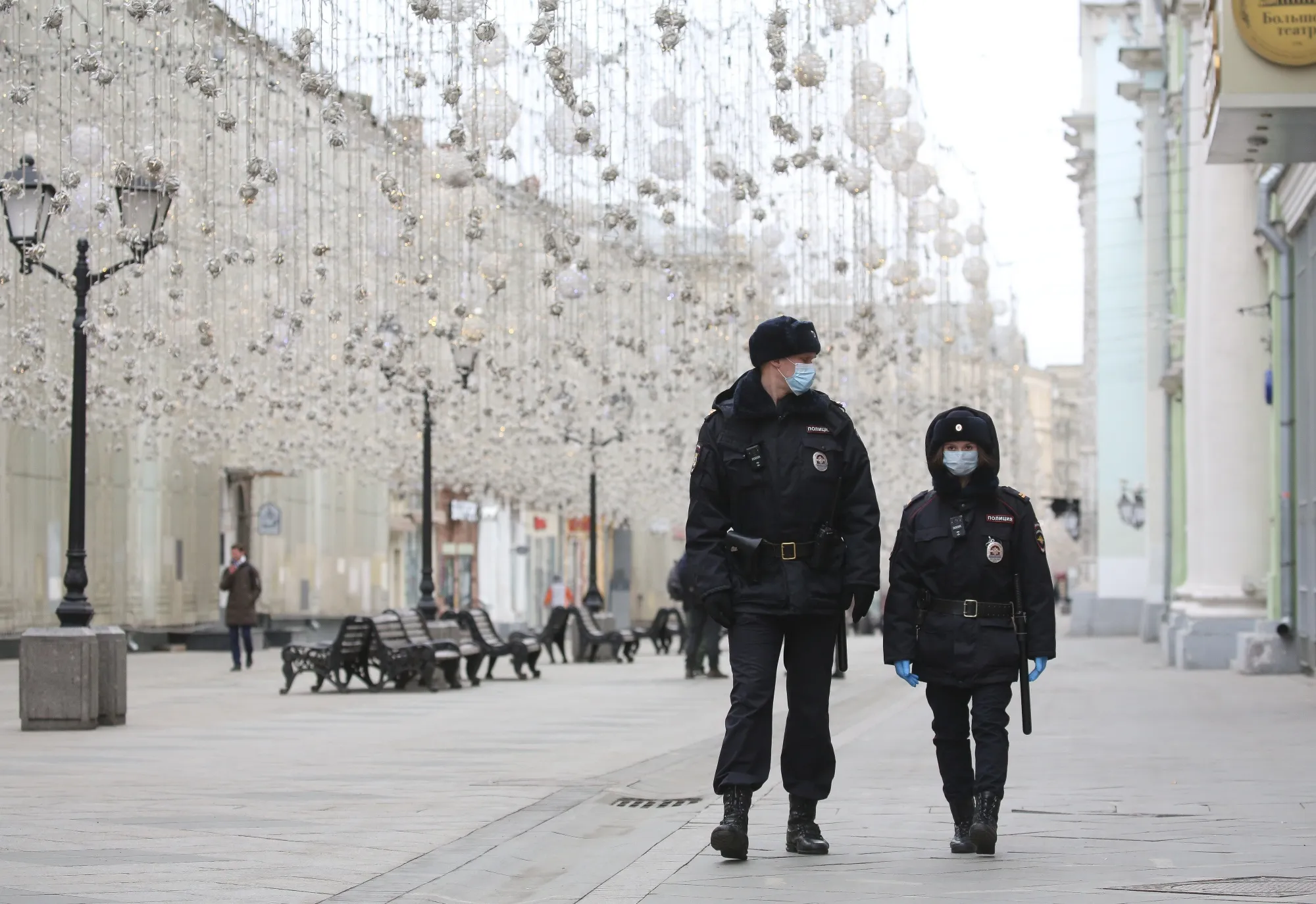 Police officers wearing protective face masks patrol in Moscow, Russia, on March 30.