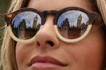Big Ben reflected in the sunglasses of a bystander in London.