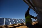 A worker alters the angle of a solar panel at a solar power plant operated by Ingeneieria y Electricidad Rodriguez SL in Villanueva de los Infantes, Spain.