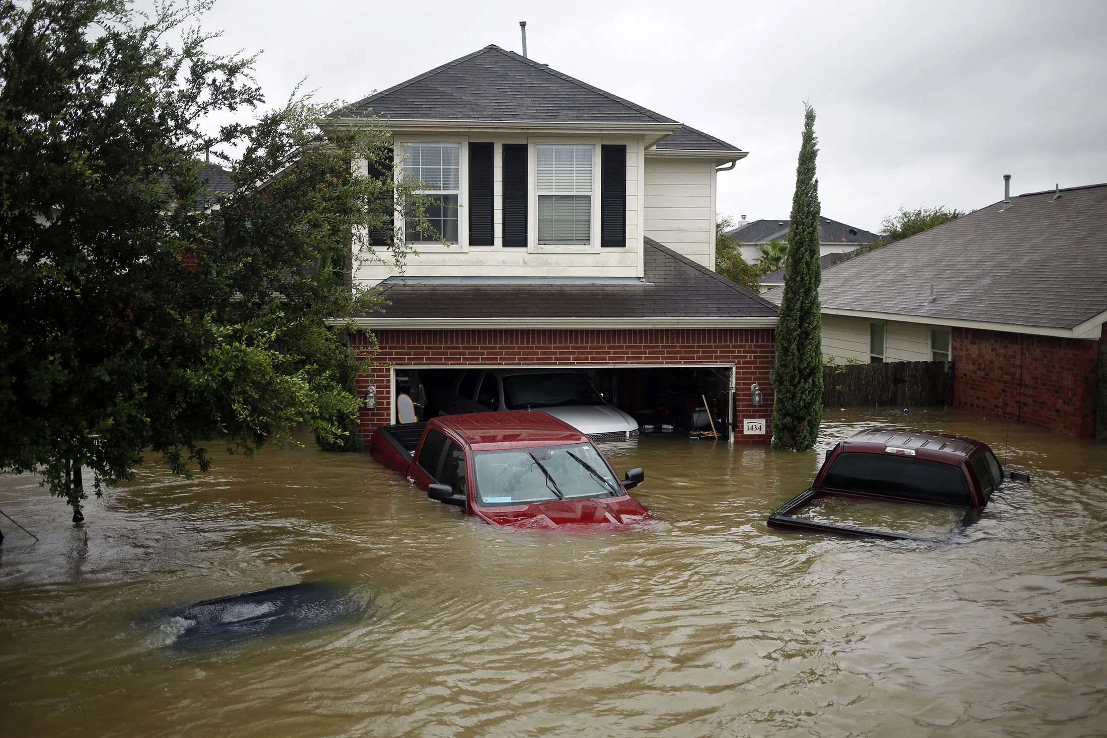 Houses and vehicles&nbsp;stand in floodwaters due to Hurricane Harvey in Spring, Texas, on Aug. 28, 2017.&nbsp;