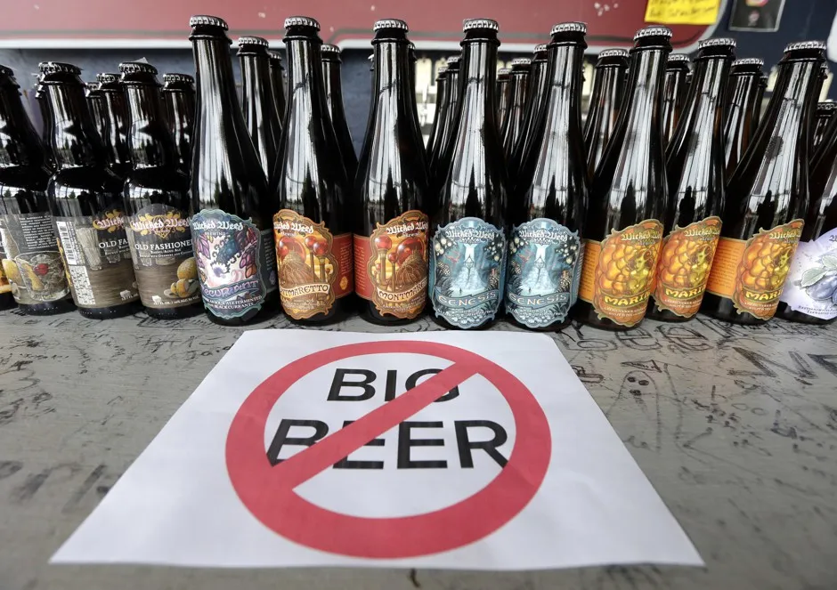 A message against the beer conglomerates is displayed before a selection of Wicked Weed beers at Brawley's Beverage in Charlotte, NC
