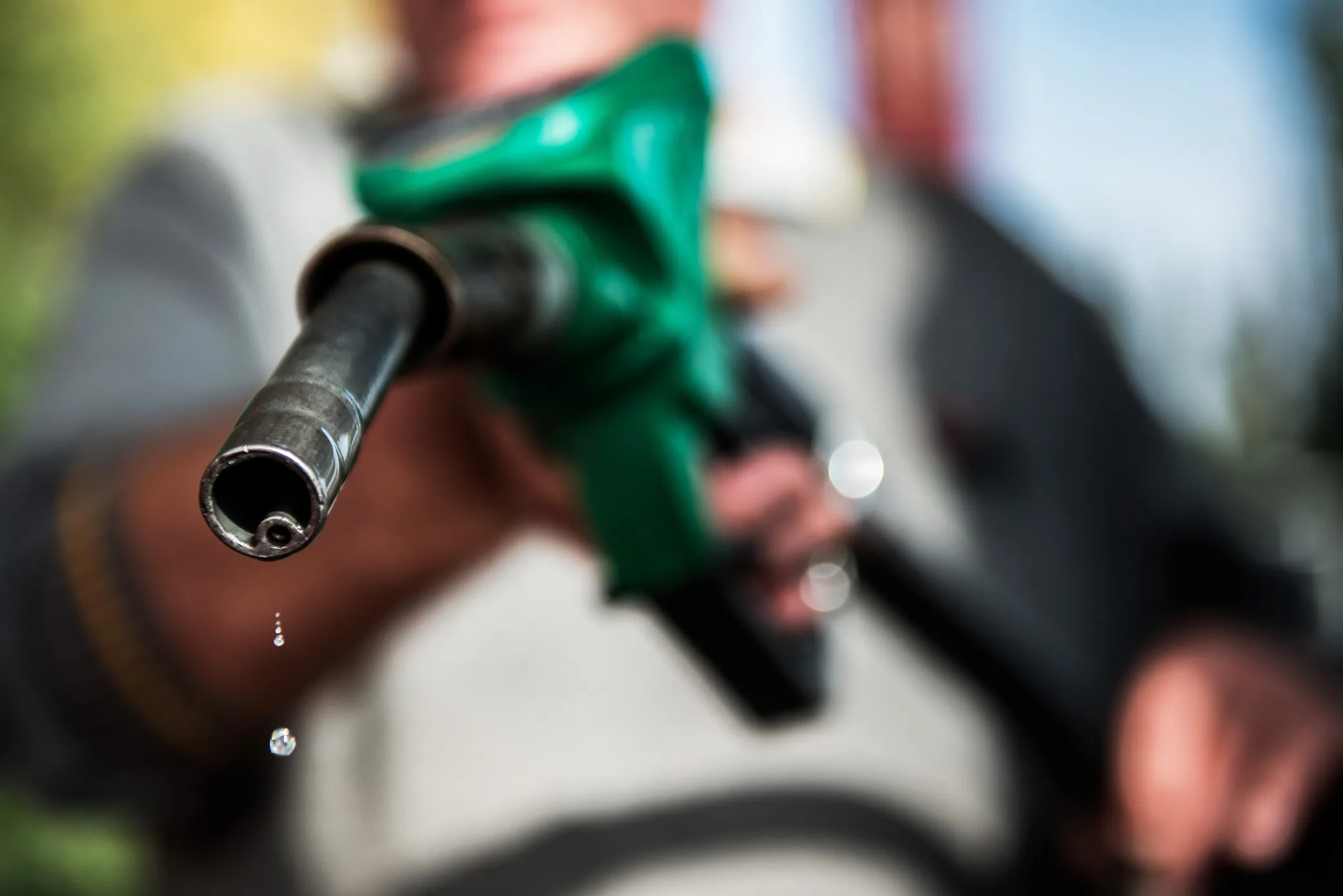 An employee fills a car with fuel at a&nbsp;gas station in Szigliget, Hungary.