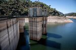 Marks from previously high water levels on towers by the Sau dam in Vilanova de Sau, Spain, on Saturday, Aug. 20, 2022. In the midst of an arid summer that set heat records across Europe, the continent’s rivers are evaporating.