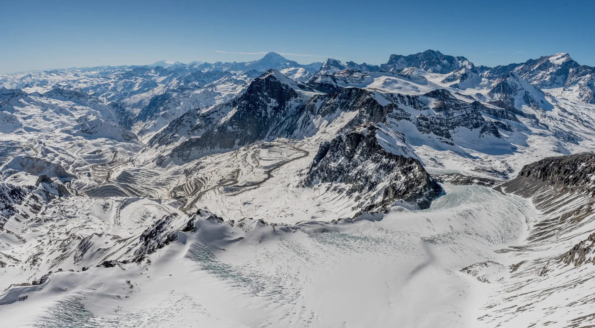 An aerial view of the Andina and Los Bronces mines, and of a glacier located in the Andes mountains above Santiago, Chile.