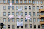 Banners on Berlin's Karl Marx Allee protest the sale of apartments to Real Estate company Deutsche Wohnen