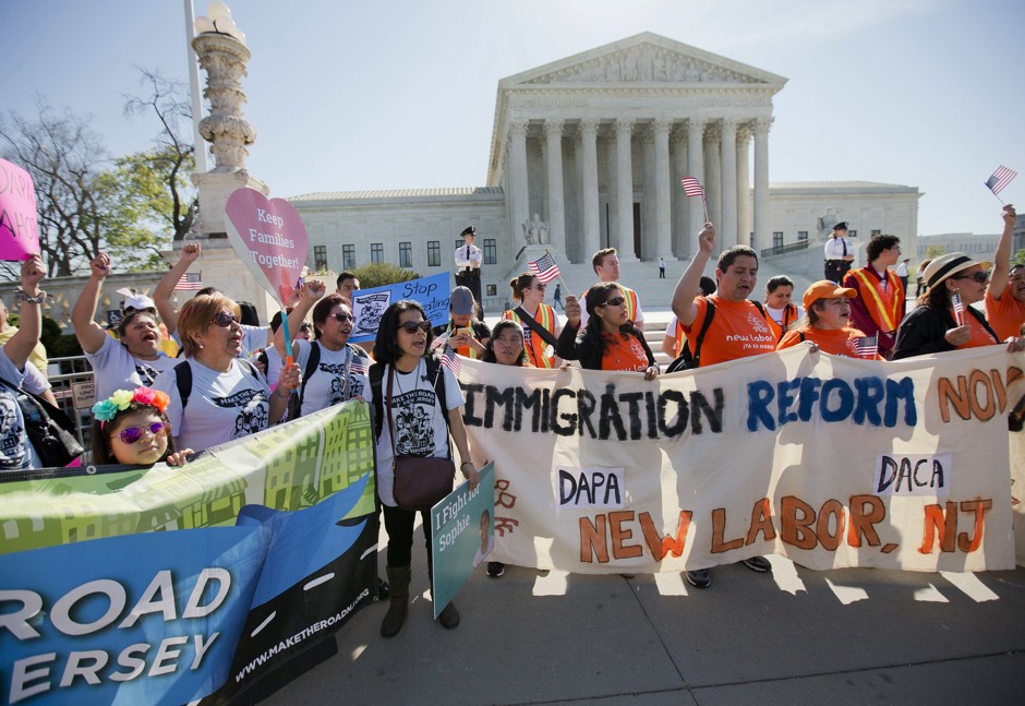 Outside the U.S. Supreme Court, immigration activists rallied Monday. 