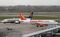 A RyanAir Holdings Plc aircraft taxis past an Airbus A320-214 aircraft, operated by EasyJet Plc, at Manchester airport in Manchester, U.K., on Tuesday, Jan. 29, 2013. Manchester Airports Group, owner of Britain's busiest airport outside London, is buying Stansted from Heathrow Airport Ltd., which is ceding 100 percent of Stansted to comply with regulatory requirements. Photographer: Paul Thomas/Bloomberg