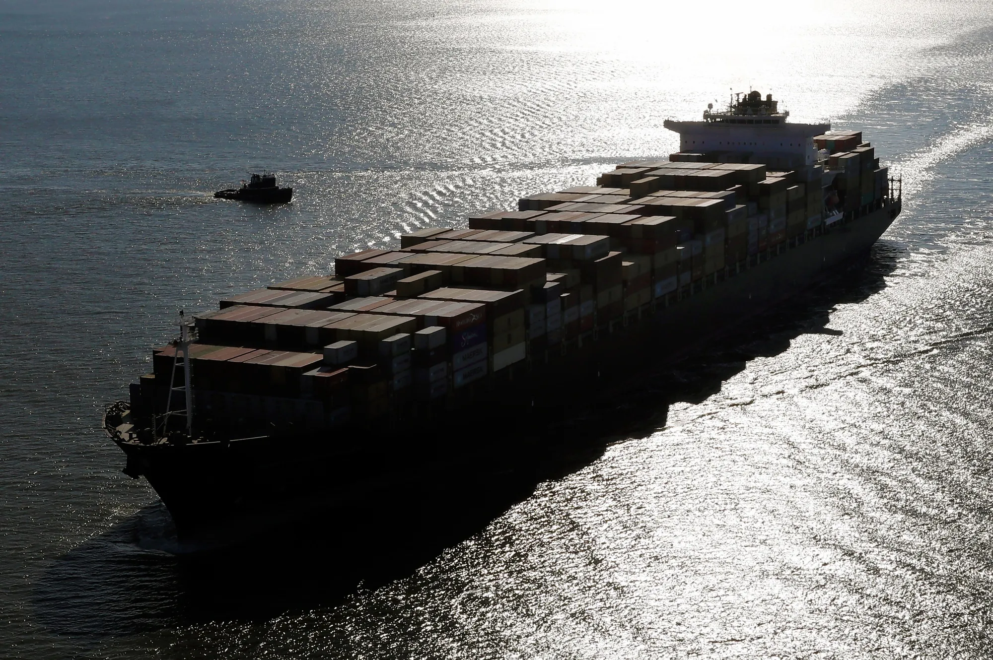 A container ship sails into New York Harbor.