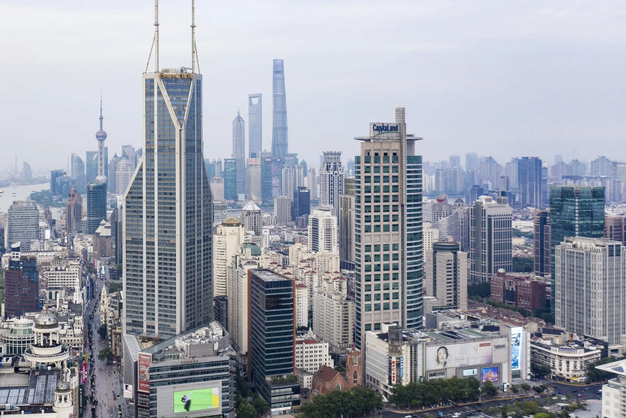 China races to solve $148 billion property threat as leases end; Shanghai and Guangzhou propose lease costs of at least 70% of benchmark