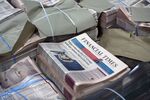 Bundles of the Financial Times newspaper sit at a John Menzies Plc distribution center in London, on July 23,.
