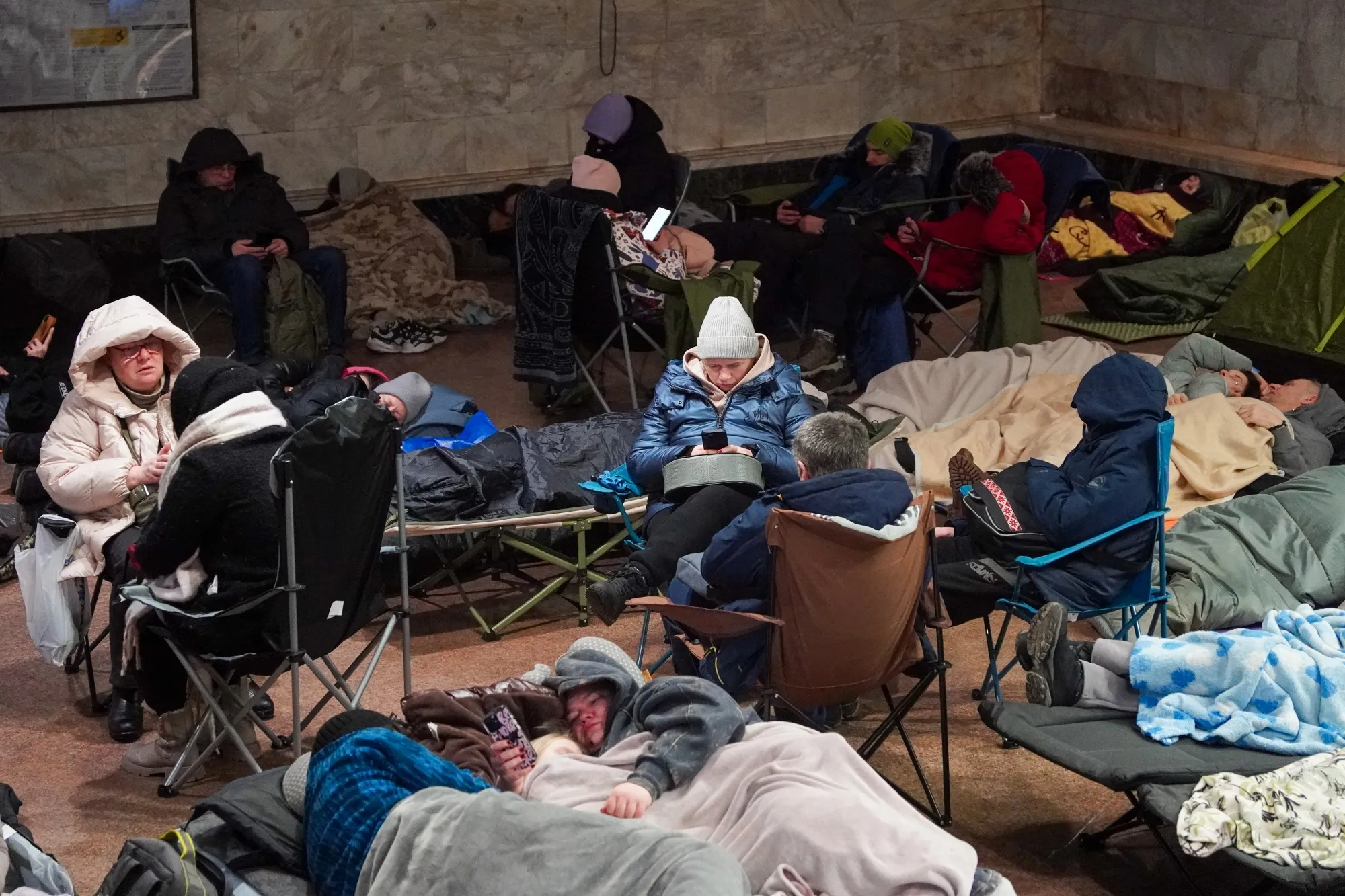 People take shelter at a metro station a Russian air attack in Kyiv on Feb. 3.