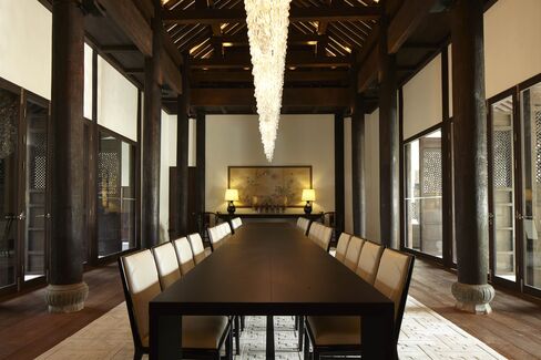 Vintage teak columns anchor each side of the dining room; there are 164 in total, sourced rom northern Thailand and Myanmar.