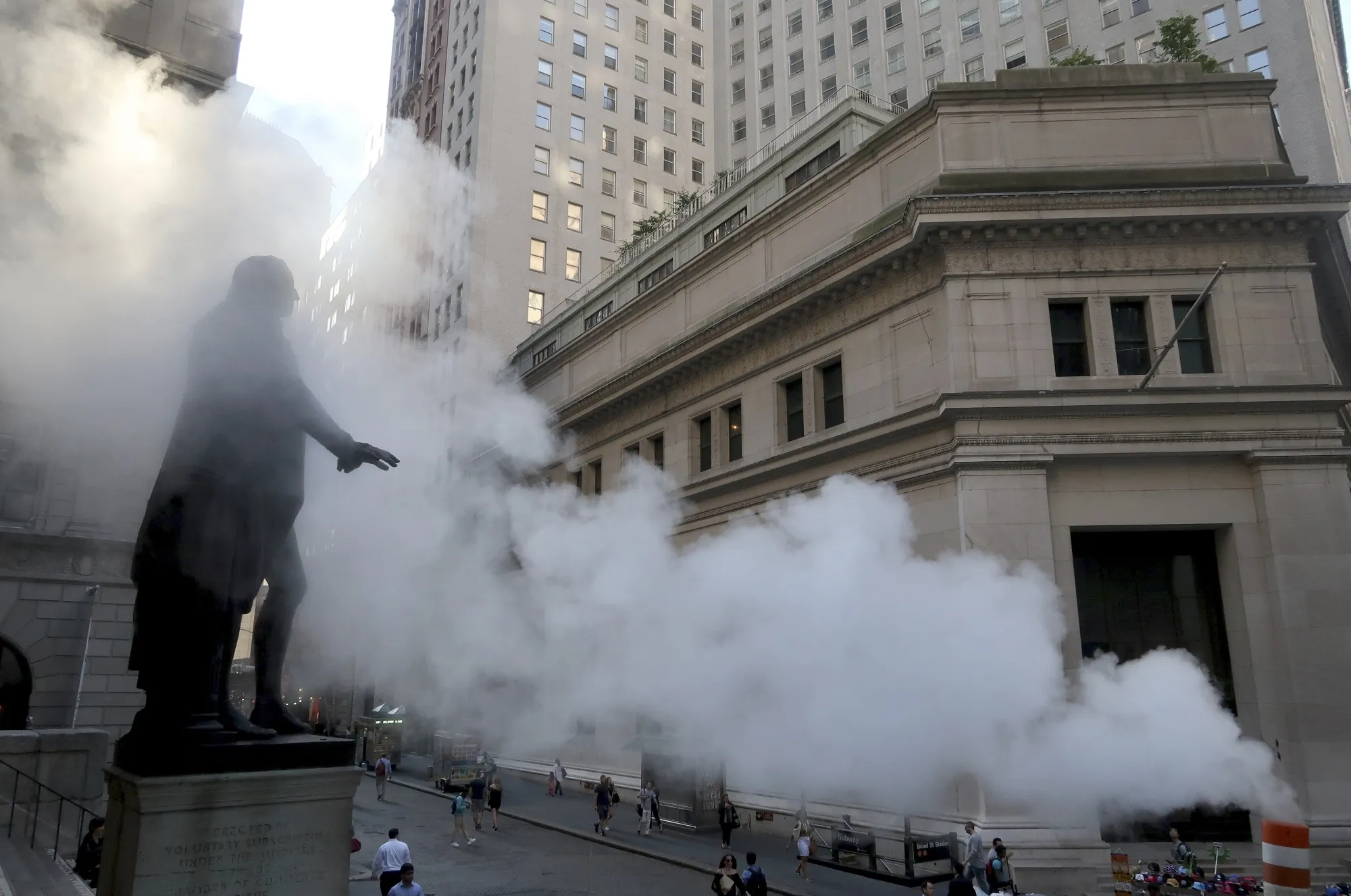 NEW YORK, NY - SEPTEMBER 23: The George Washington Statue in front of Federal Hall on Wall street is engulfed in a cloud of steam on September 23, 2016 in New York City. (Photo by Gary Hershorn/Getty Images)