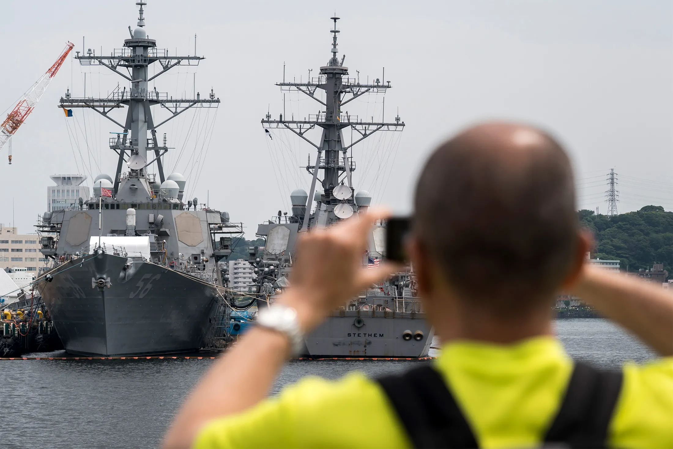 The USS John S. McCain, left, moored at the Yokosuka Naval Base in Yokosuka, Japan, in 2019.