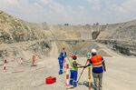 Workers survey the&nbsp;Darwendale platinum mine near Harare, Zimbabwe, on Sept. 16, 2020.