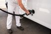 A driver refuels a vehicle at a gas station in Seattle.