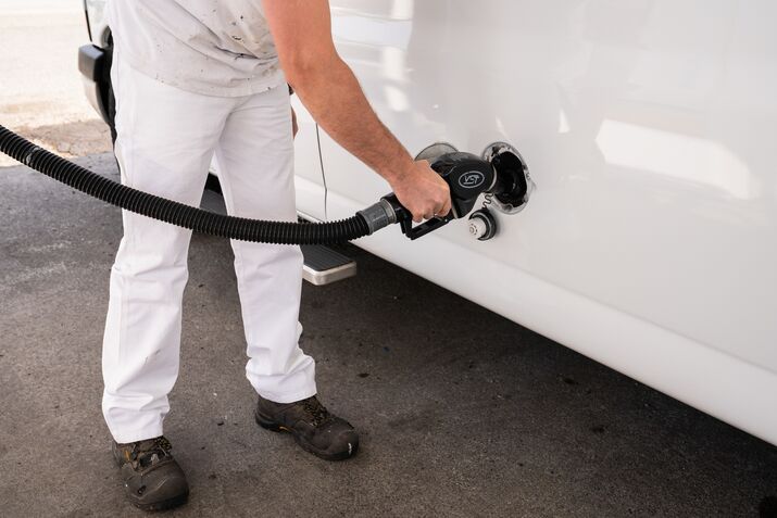 A driver refuels a vehicle at a gas station in Seattle.
