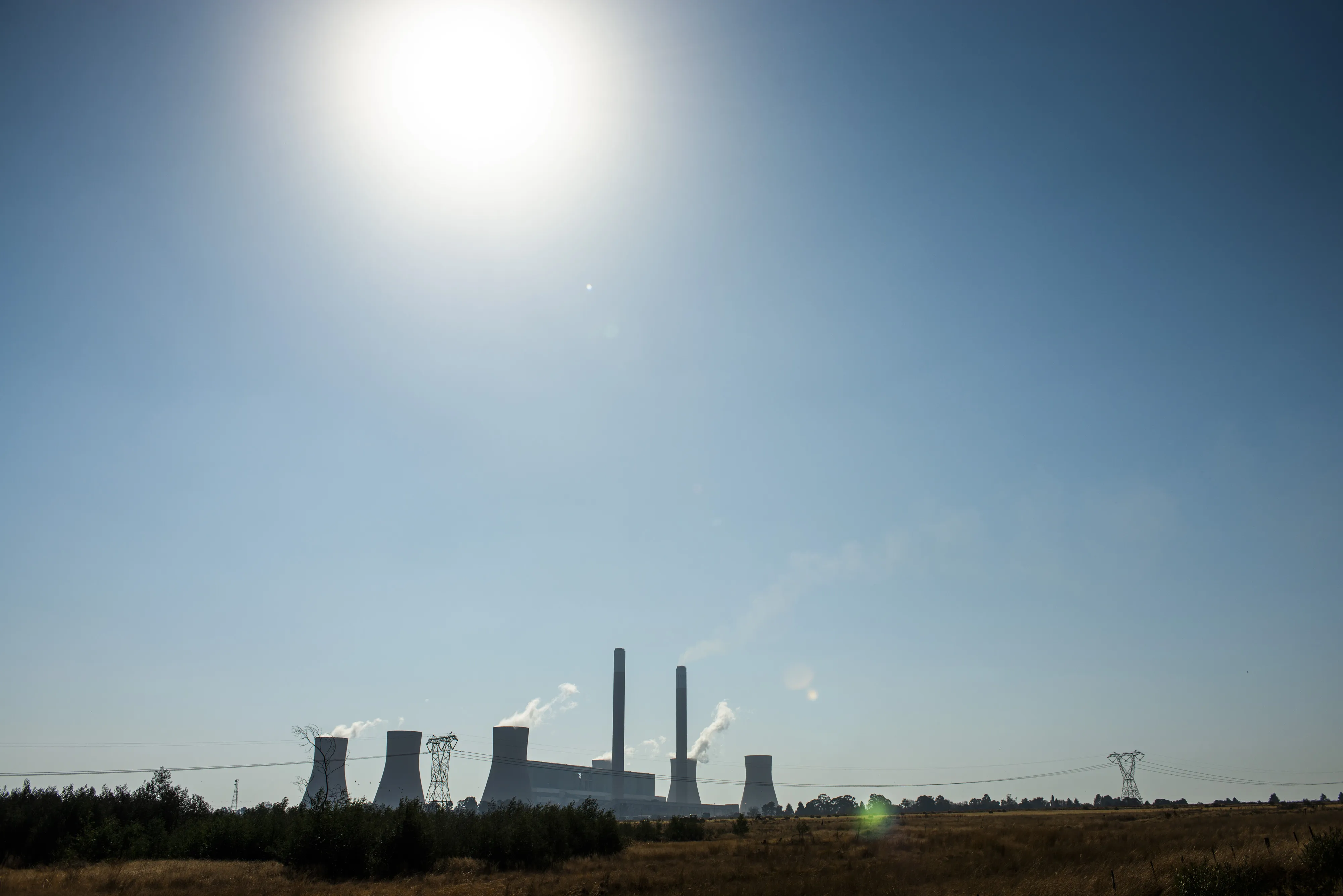 Emissions rise from the Eskom Holdings SOC Ltd. Duvha coal-fired power station near Witbank in Mpumalanga, South Africa, on Wednesday, June 12, 2019.