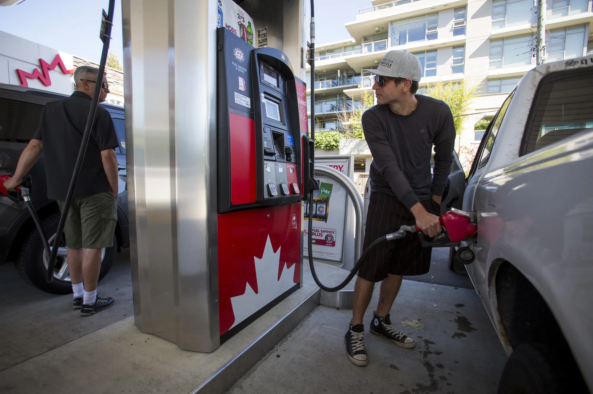 A driver fills up his car at a Petro-Canada gas station in Vancouver, British Columbia.