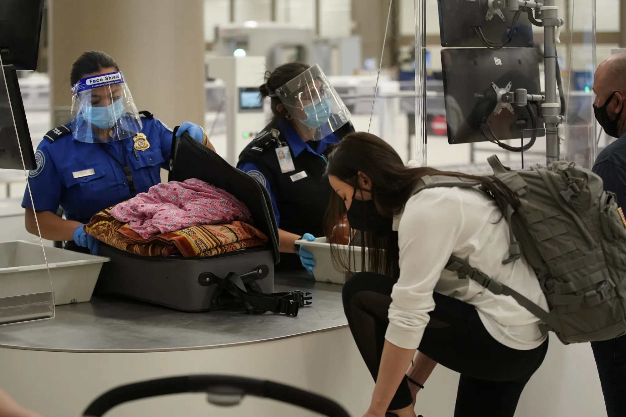 TSA&nbsp;agents check the luggage of a travleres at the security screening center at the&nbsp;Salt Lake City International Airport in Salt Lake City, Utah, on Sept. 15.