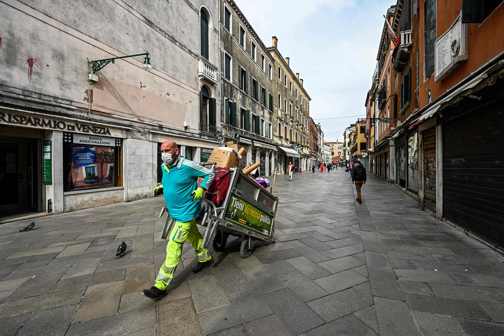 A man pulls a trolley in Venice on May 13.&nbsp;