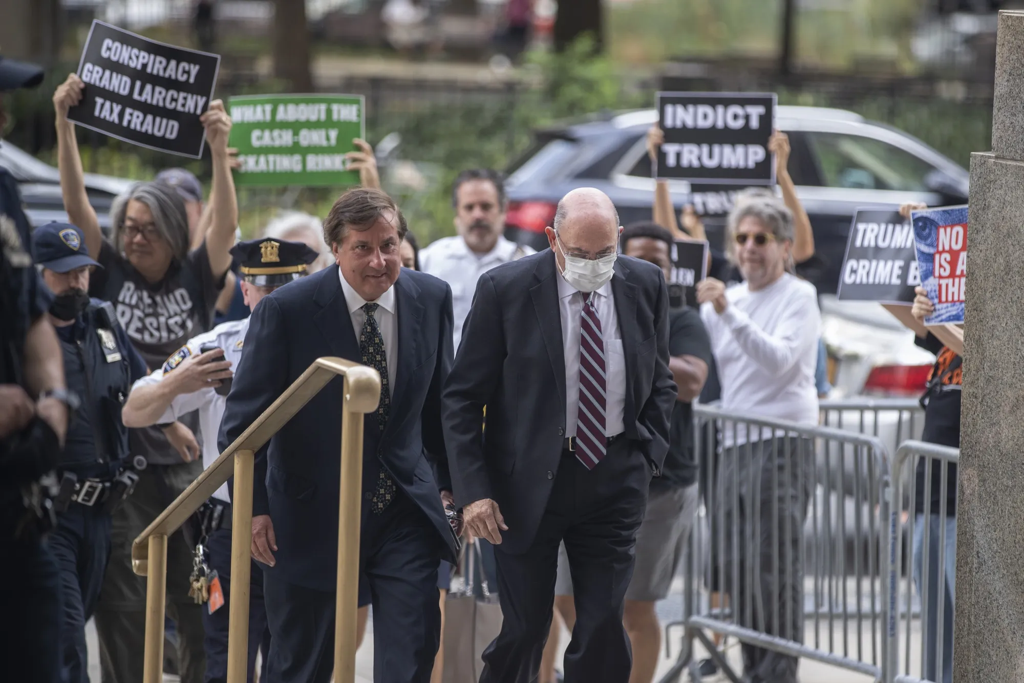 Allen Weisselberg, right,&nbsp;arrives to criminal court in New York, on Aug. 12.
