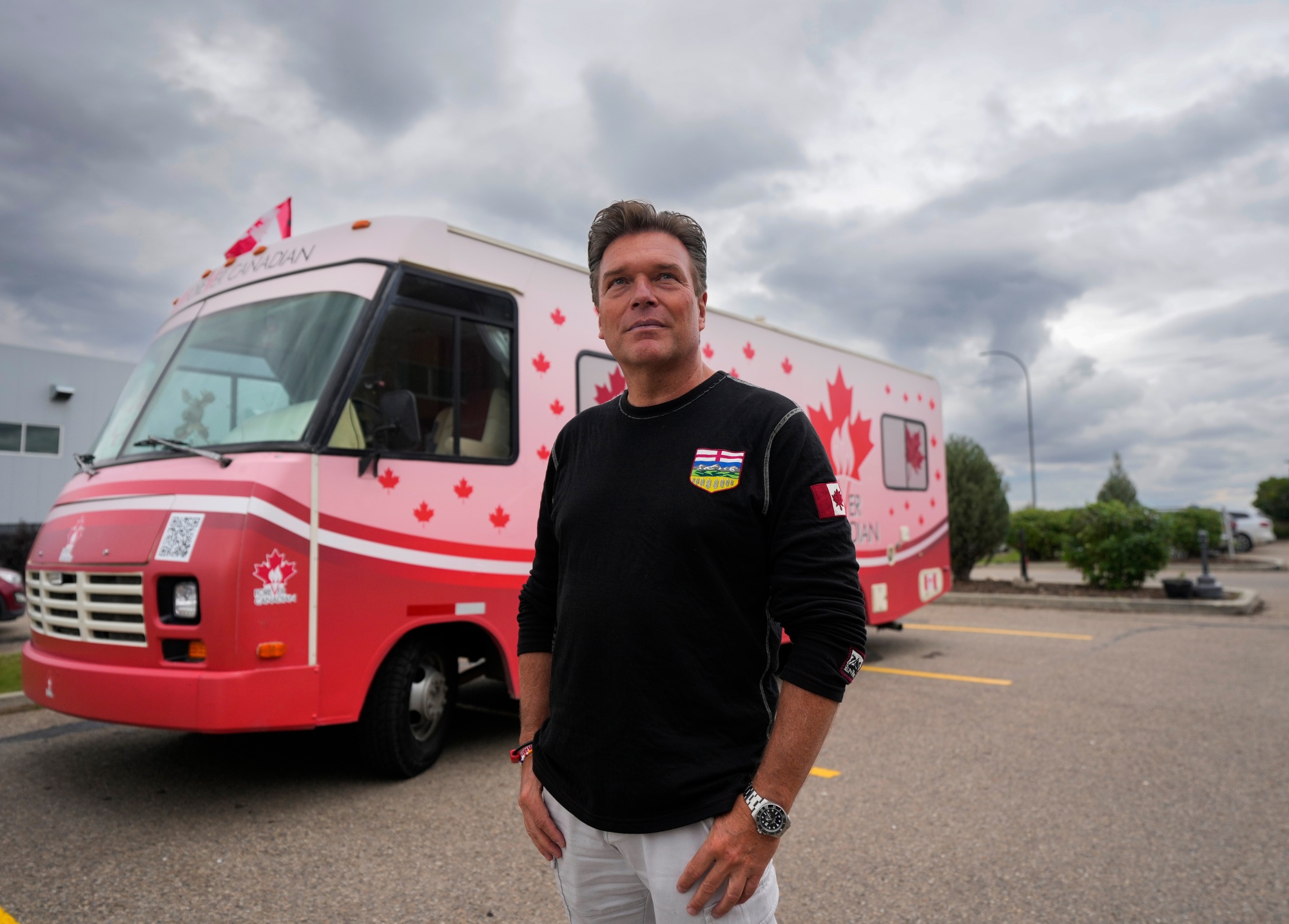 Thomas Lukaszuk and his Forever Canadian tour bus.