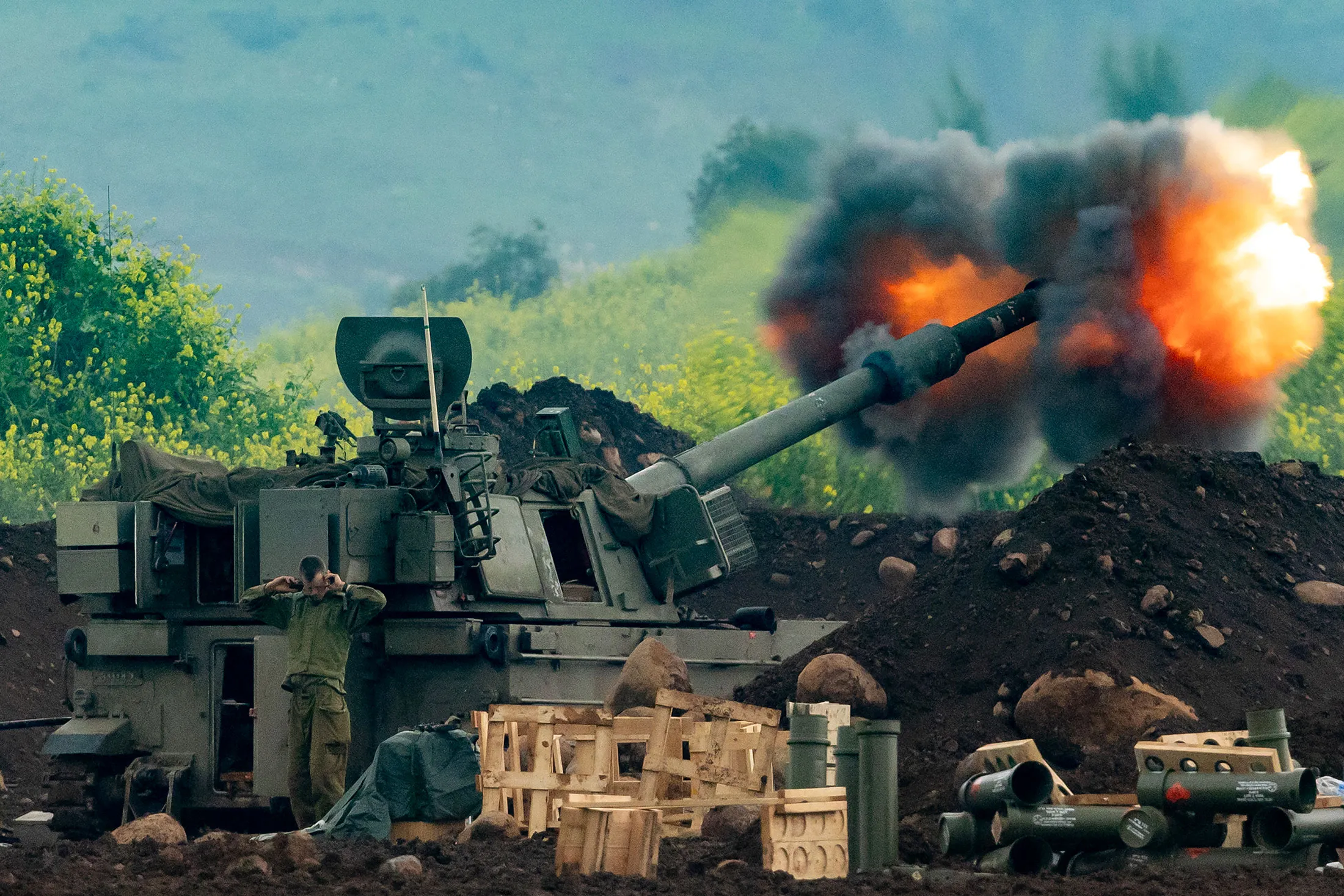 An Israeli self-propelled howitzer fires towards Lebanon from a position in northern Israel, on March 15.