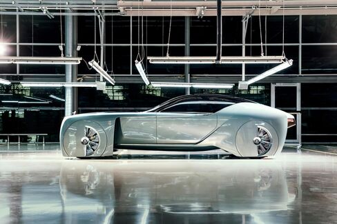 The Vision Next 100 has a glass canopy that retracts when the coach doors swing open.