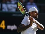Nick Kyrgios returns the ball during a men's singles match on the sixth day of the 2022 Wimbledon Championships at The All England Tennis Club in Wimbledon, southwest London, on July 2.&nbsp;