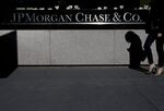 A pedestrian walks past JPMorgan Chase & Co. headquarters in New York.
