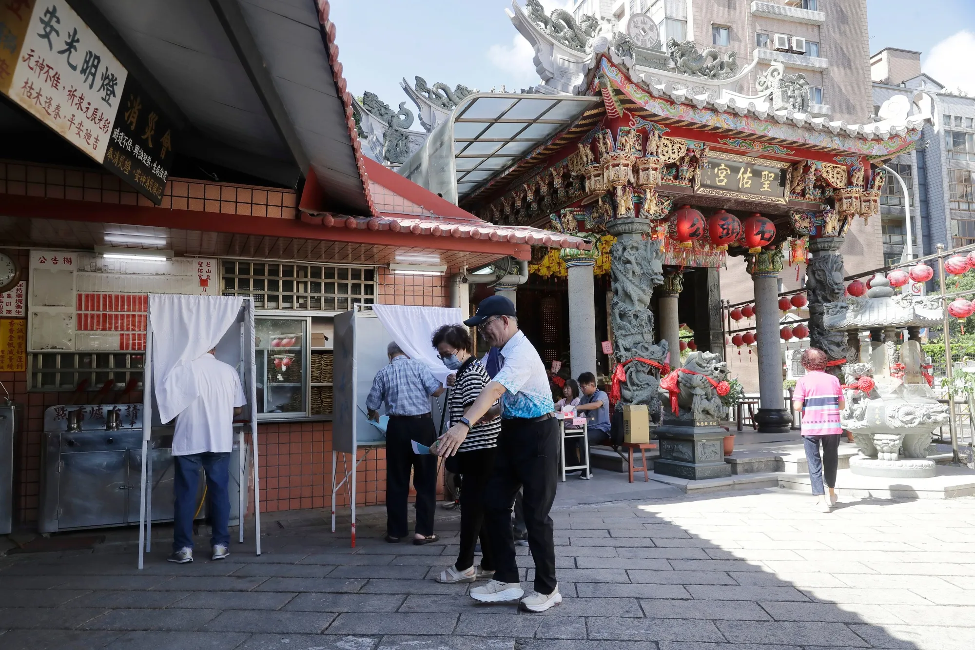 Voting at a polling station in Taipei, Oct. 18.