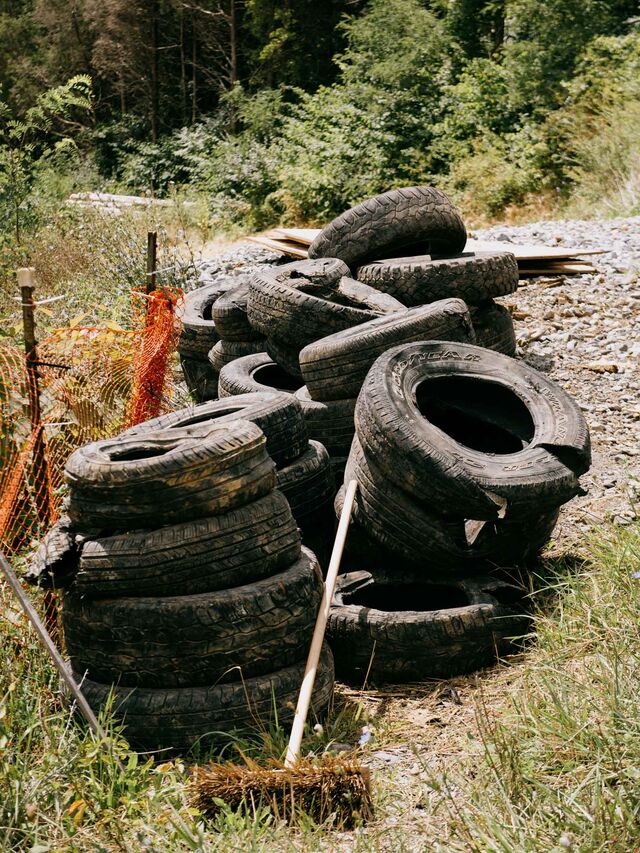 Pembroke, VA (Giles County) Used tires are piled next to the entrance to a MVP right of way to help control erosion around the entrance.