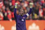 Canada keeper Milan Borjan reacts at the end of a World Cup soccer qualifier against the United States in Hamilton, Ontario, Sunday, Jan. 30, 2022. (Nathan Denette/The Canadian Press via AP)