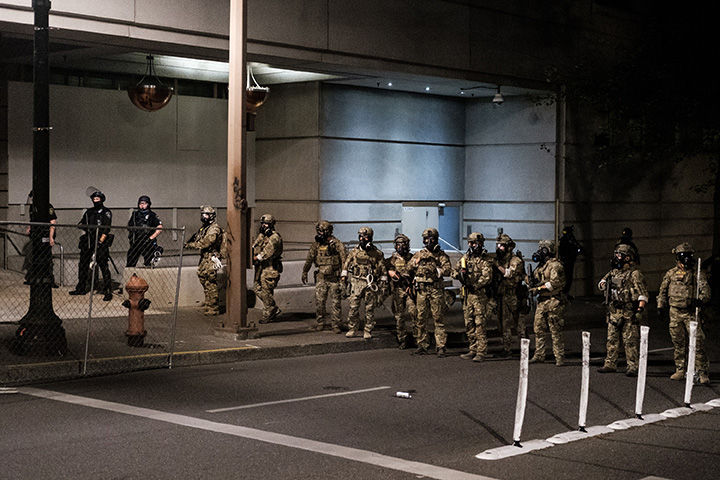 Federal officers prepare to disperse the crowd of protestors outside the Multnomah County Justice Center in Portland, Oregon, on July 17.