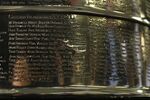 The names of the 2010 Stanley Cup Champion Chicago Blackhawks, left, are displayed on the Stanley Cup in the lobby of the United Center during an NHL hockey news conference on June 11, 2013 in Chicago. Representatives for the Blackhawks and a former player who is suing the team over how it handled his allegations of sexual assault against an assistant coach were meeting with a mediator Wednesday, Dec. 15, 2021 for the first time in hopes of resolving the case. (AP Photo/Charles Rex Arbogast, File)