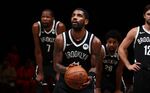 Kyrie Irving shoots a free throw during a preseason game in 2020.