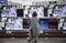 A customer looks at flat screen TVs. Photographer: Qilai Shen/Bloomberg