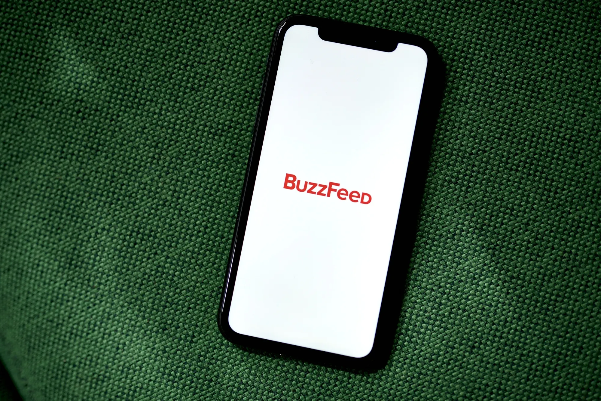 BuzzFeed, the struggling digital media company, is selling assets to pay down debt.