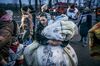 A Ukrainian carries a child in a blanket after crossing the border in Siret, Romania, on March 2, 2022.