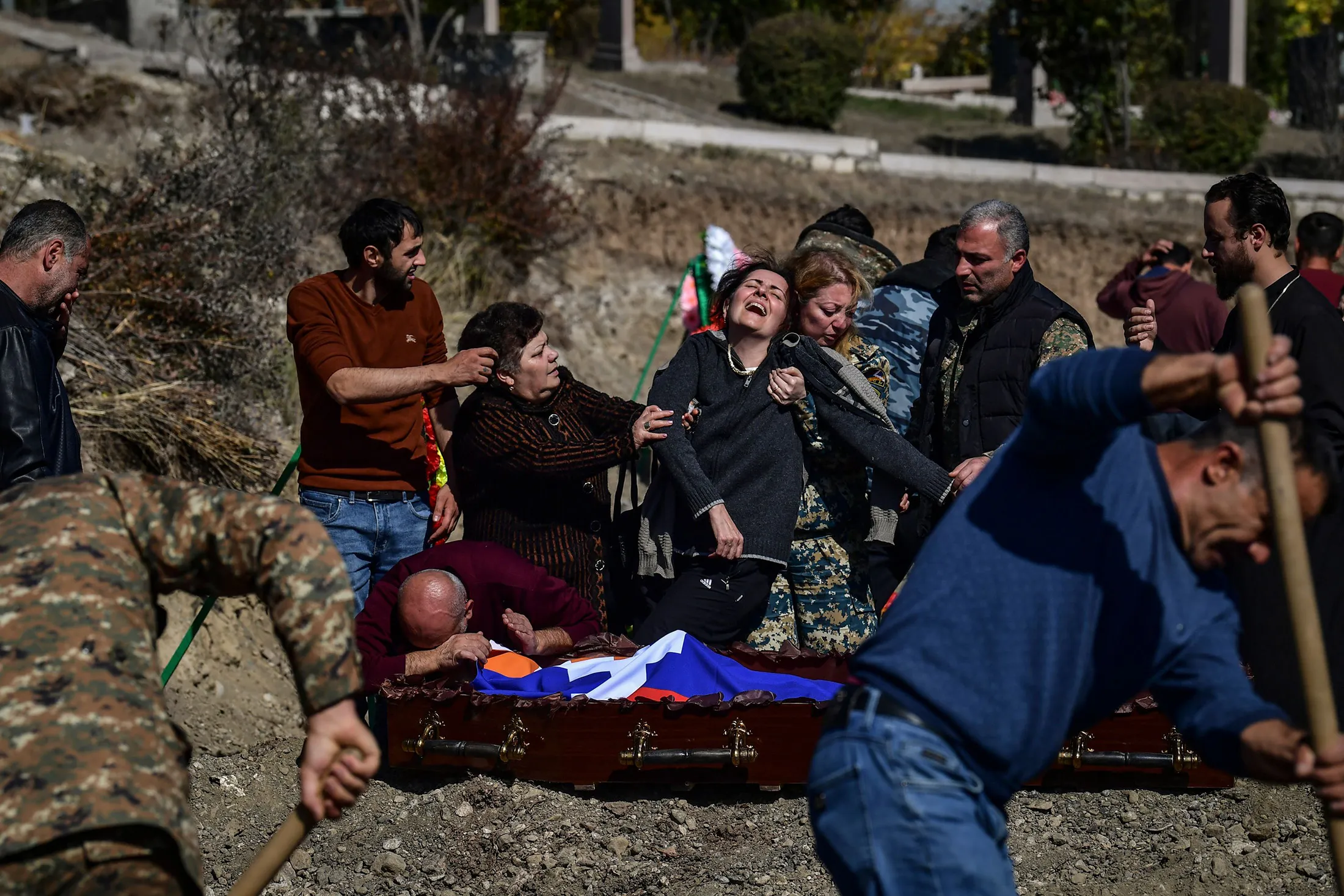 A mother mourns above the coffin of her child, killed during fighting over the breakaway region of Nagorno-Karabakh,&nbsp;in Stepanakert on Oct.&nbsp;17.