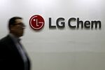 An attendee walks past the LG Chem