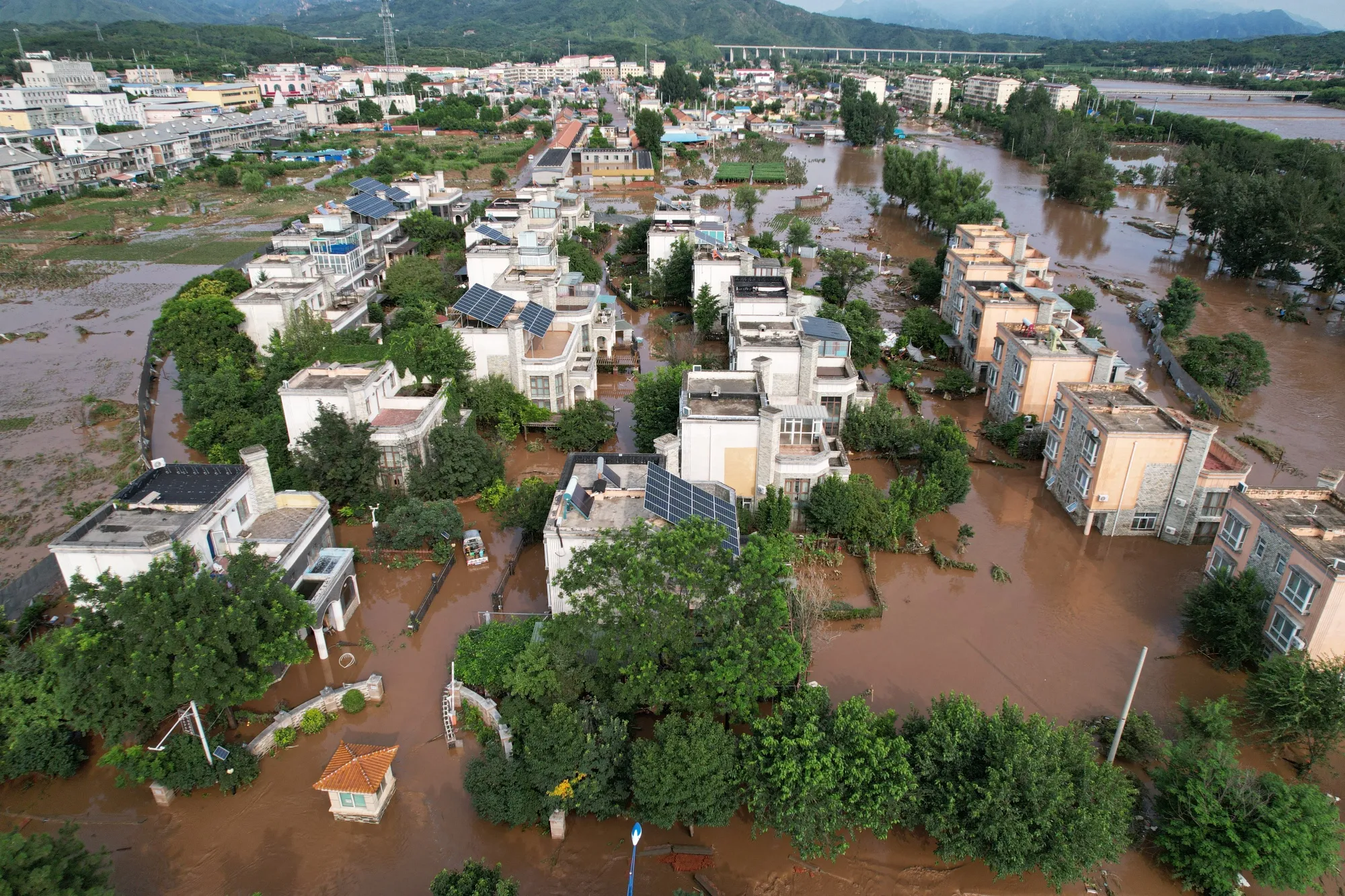 Submerged residential buildings after heavy rains on the outskirts of Beijing on July 28.