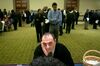 A job seeker speaks to a résumé professional at a National Career Fairs job fair in Arlington, Va., on Jan. 30