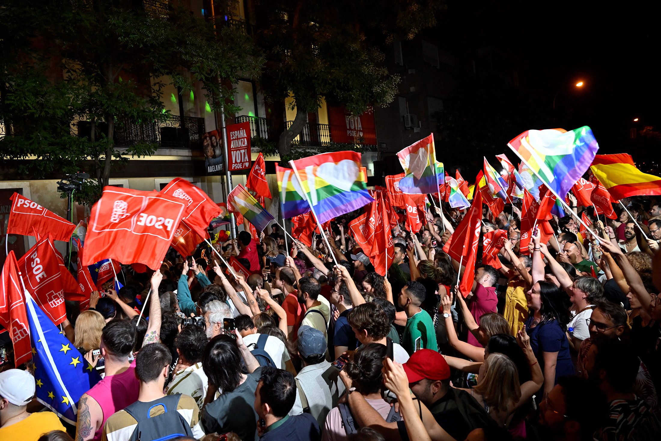 Supporters of the Socialist Party wait for Pedro Sanchez to deliver a speech at the PSOE headquarters in Madrid on July 23.