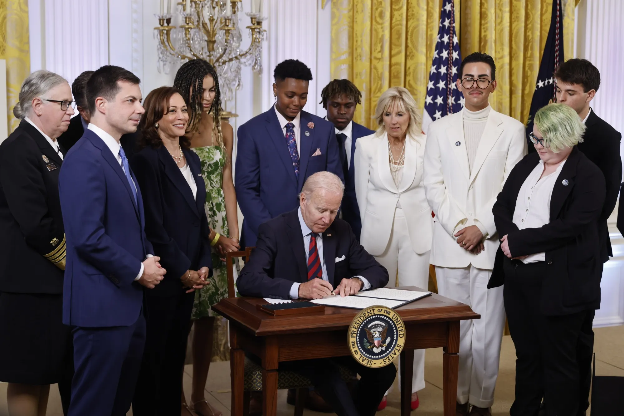 Joe Biden signs an executive order during a Pride Month event at the White House in Washington, on June 15.&nbsp;