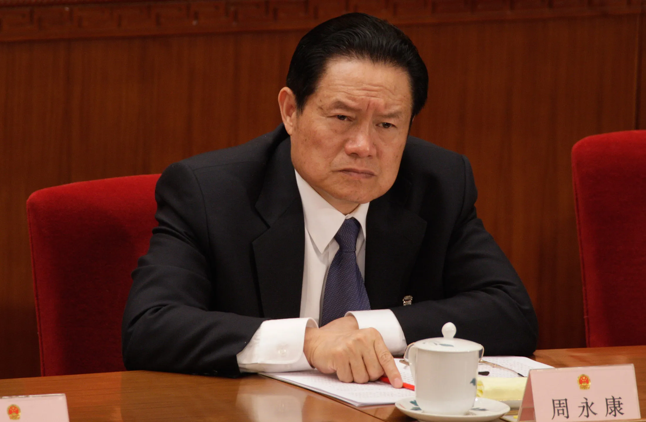 In this file photo, Zhou Yongkang, then member of the Standing Committee of the Political Bureau of the Chinese Communist Party (CCP) Central Committee, attends the second plenary session of China's 11th National People's Congress (NPC) in Beijing, China, on Saturday, March 8, 2008. Former Chinese security chief Zhou Yongkang has been sentenced to life in prison after a secret trial, making him the highest-level official prosecuted in President Xi Jinping's signature campaign against corruption.
